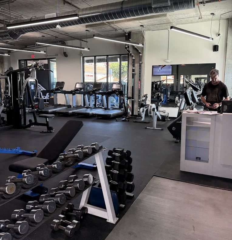 Dumbbell rack and cardio area at Bolder Fitness