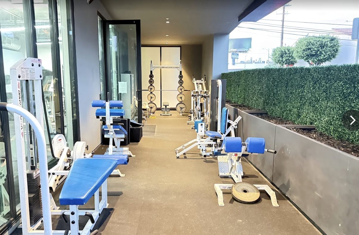 Outdoor strength training patio at Bolder Fitness with plate-loaded machines